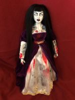 creepy girl with black hair and doll